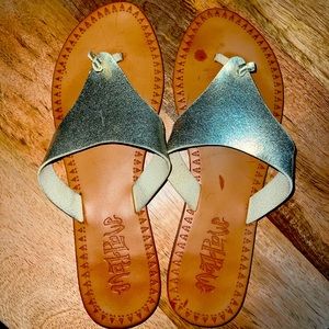 Brand is Mad Love, tan and gold sandal.